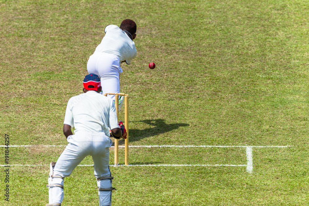 Obraz premium Cricket Action Batsman Ball Bowler Wicket Keeper Closeup unidentified.