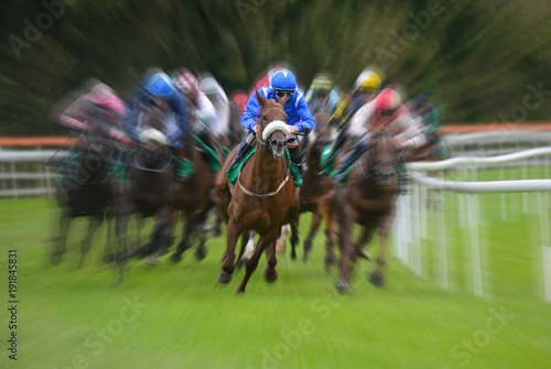 Lead racehorse and jockey zoom motion blur background