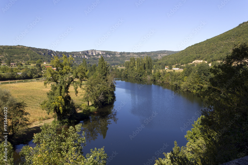 The peaceful River Lot flowing through rural countryside near Cajarc, Lot, Quercy, France, Europe