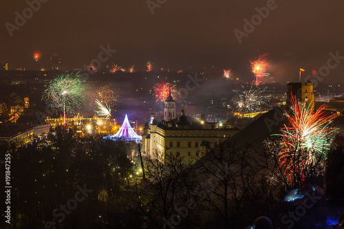 Vilnius, Lithuania January 01, 2017: Beutifull view to the main firework, at New Year night to Cathedral Square, belfry tower, Cathedral of St. Stanislaus and St. Vladislav, from hill of three crosses