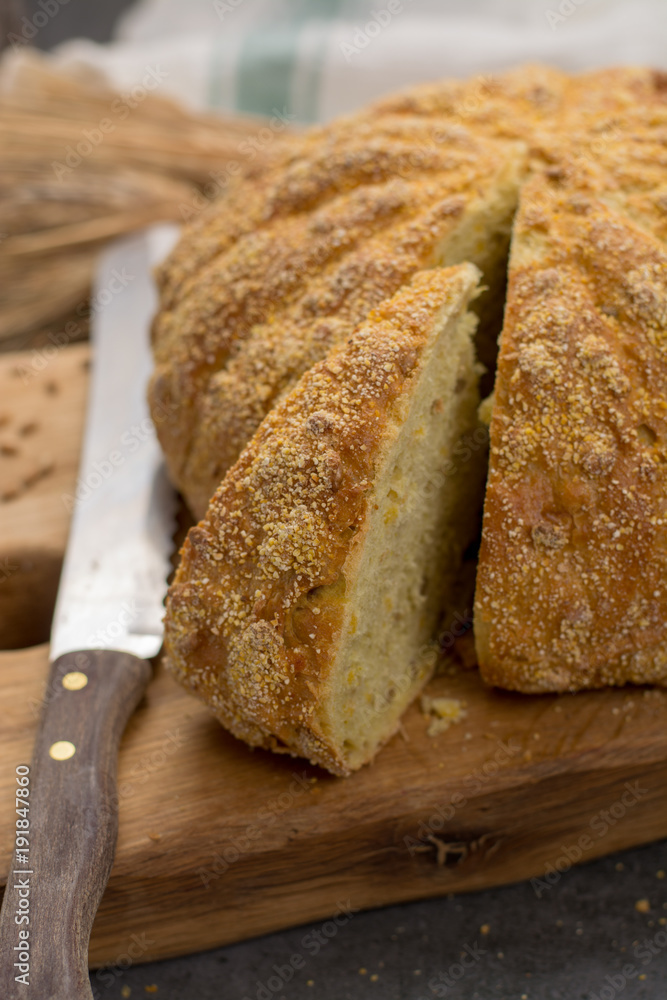 Homemade baked round bread with corn and wheat Homemade baked round bread with corn and wheat