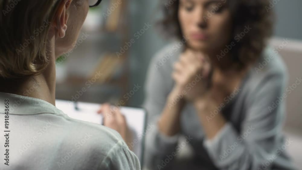 Close-up of female psychologist having session with her patient, mental health Close-up of female psychologist having session with her patient, mental health