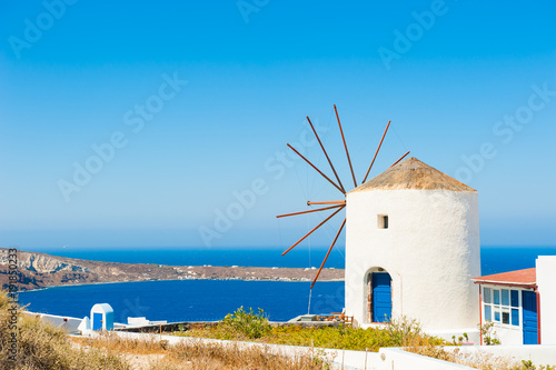 White windmill on Santorini island, Greece