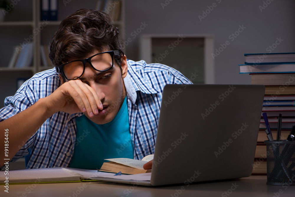 Student preparing for exams late night at home Student preparing for exams late night at home