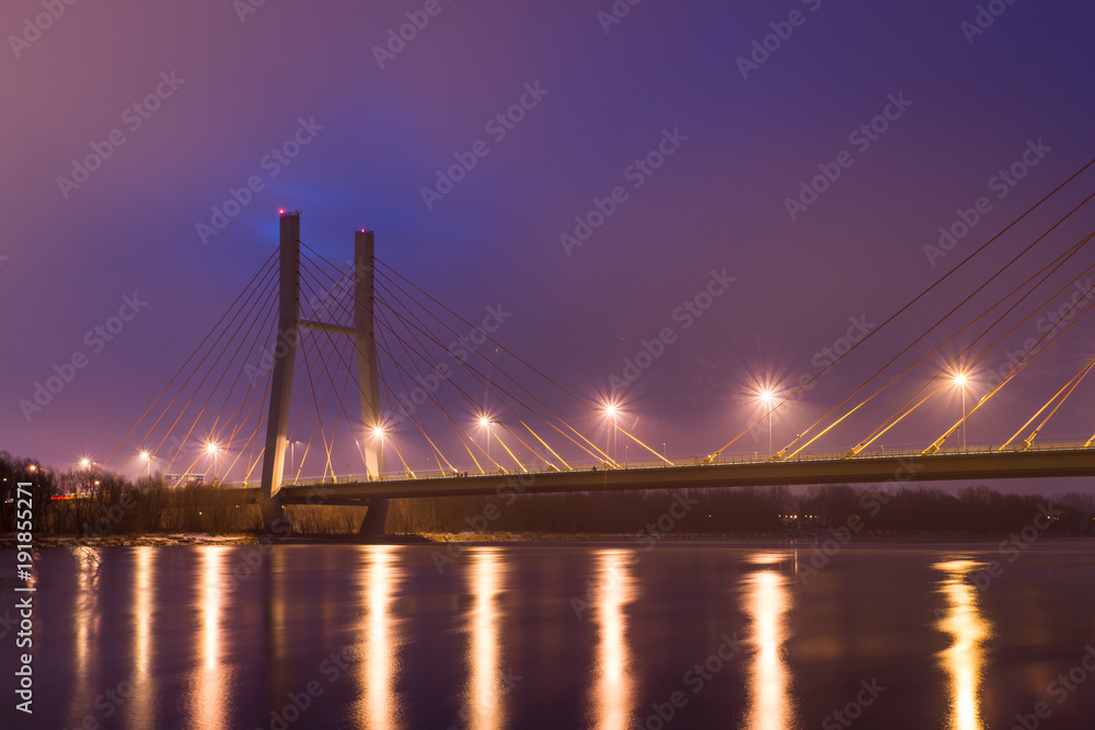 Fototapeta premium Siekierkowski bridge at night in Warsaw, Poland
