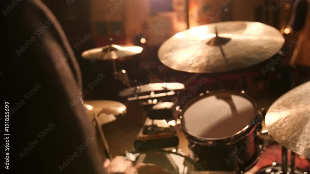Drummer during concert, headshot with flare. Drummer during concert, headshot with flare.