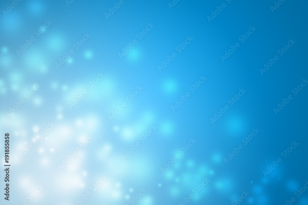 Blue background with a beautiful white bokeh.