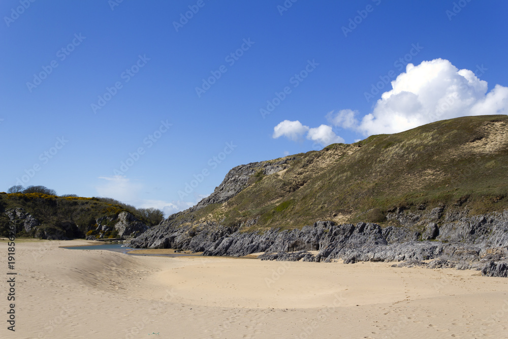 Looking back on Broad Haven South beach towards Bosherston Lily Ponds spring sunshine, Pembrokeshire, Wales, UK Looking back on Broad Haven South beach towards Bosherston Lily Ponds spring sunshine, Pembrokeshire, Wales, UK