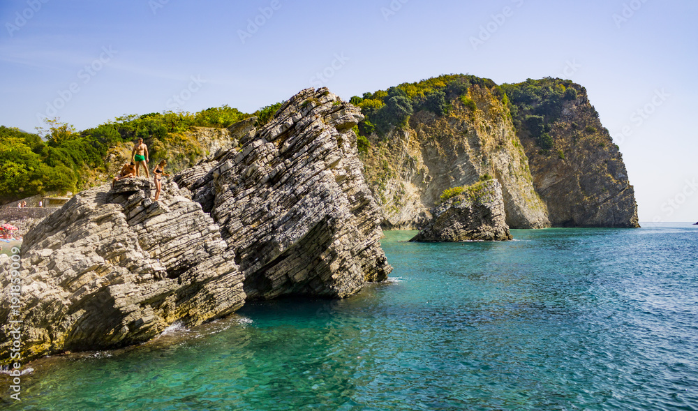 Rocky cliffs in Balkans with people jumping