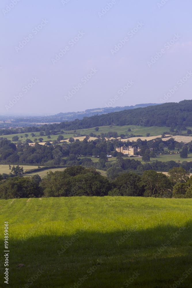 Evening sunshine view of the idyllic Cotswold countryside near Winchcombe, Gloucestershire, UK.