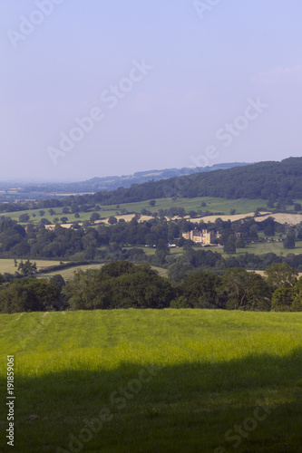 Evening sunshine view of the idyllic Cotswold countryside near Winchcombe, Gloucestershire, UK.