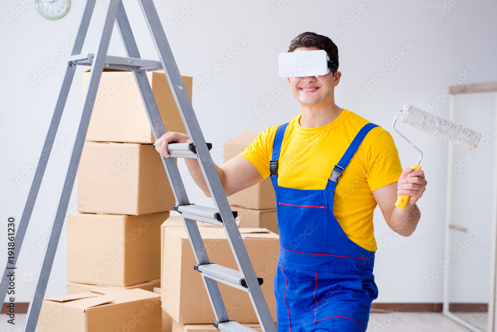 Painter contractor working with virtual reality goggles Painter contractor working with virtual reality goggles