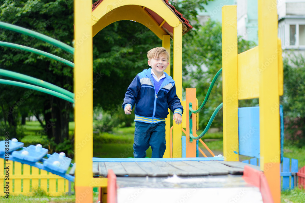 Funny children play on a children's playground Funny children play on a children's playground