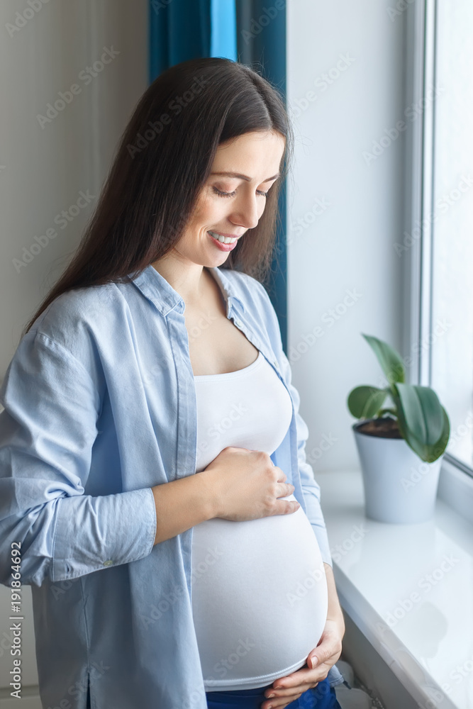portrait of happy pregnant woman