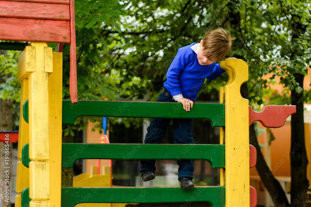 Funny children play on a children's playground Funny children play on a children's playground