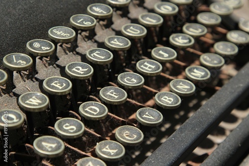 A close up shot of a vintage typewriter. This image can be used to represent the concept of writing.