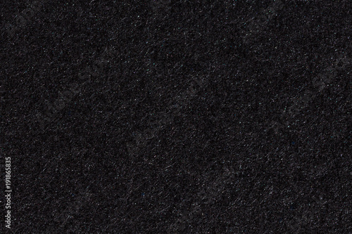 Black paper texture or background.