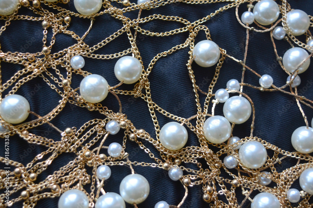 gold threads with pearls on black silk, beautiful luxury background gold threads with pearls on black silk, beautiful luxury background