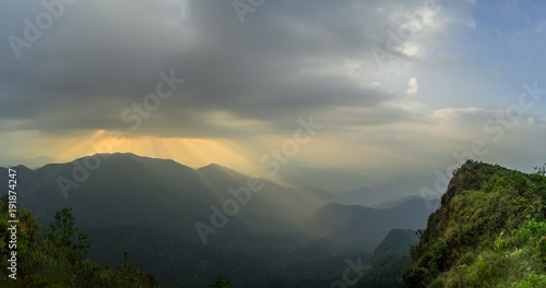 Panorama light beam from the clouds rain is beautiful. Opposite on the other side of the sky bright. Khao San Nok Wua at Kanchanaburi Province  Thailand. subject is blurred.