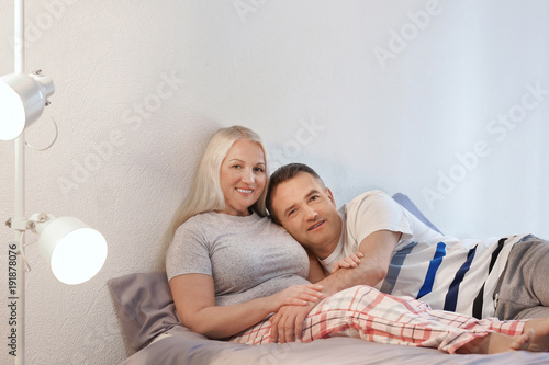 Senior couple on bed together