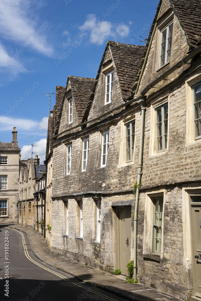 Quaint and historic buildings line the streets in the older parts of Cirencester, Gloucestershire, UK Quaint and historic buildings line the streets in the older parts of Cirencester, Gloucestershire, UK