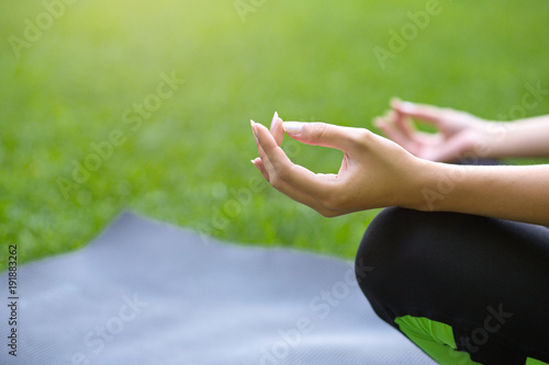 Closeup of yoga woman hand in lotus pose © Prostock-studio