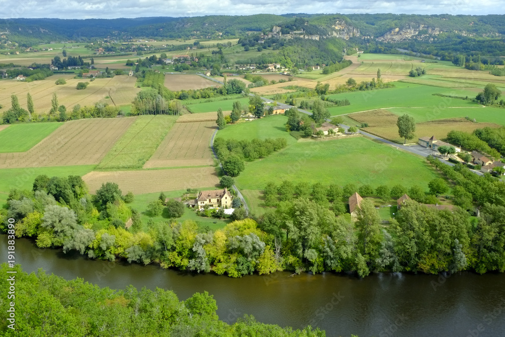 Late summer view over patchwork fields and river of the Dordogne valley near Castelnaud-la-Chapelle, Aquitane, France