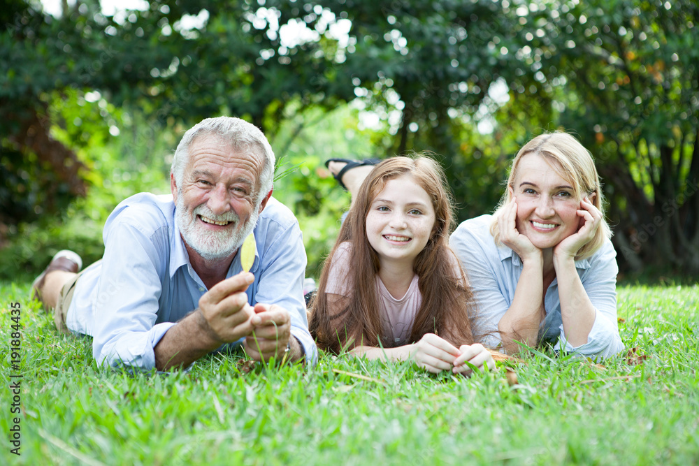 Happy Old Grandparents Having Fun With Grandchildren In Park Happy Old Grandparents Having Fun With Grandchildren In Park