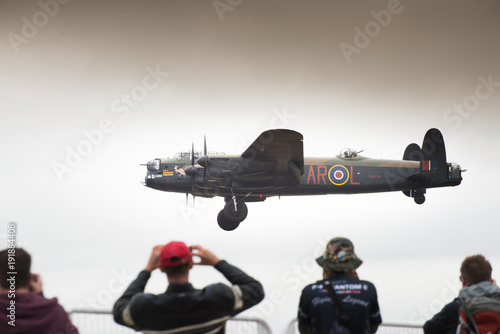 Lancaster bomber coming into land at air show photo