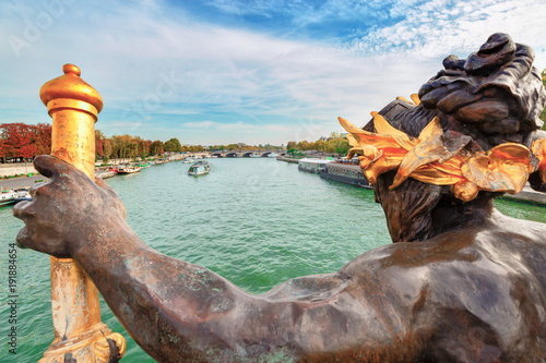Paris, France. Famous view over Seine river from bridge of Alexander III, decorative statue at foreground. Famous and popular European travel destination. © Feel good studio