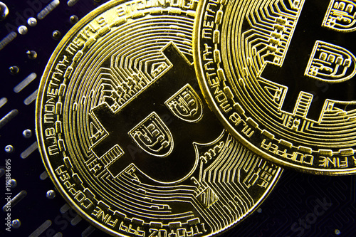 Cryptocurrency Bitcoin On The Motherboard. Gold Coin. Virtual Currency.