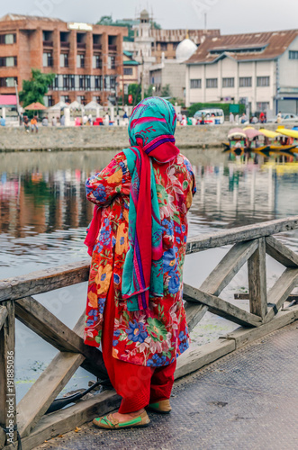 Indian woman with traditional costume on the bank of Dal Lake