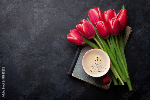 Red tulip flowers bouquet and coffee cup