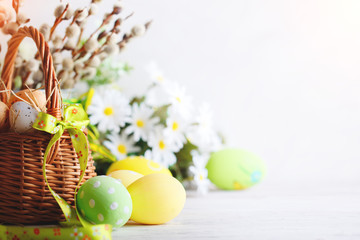 Happy Easter. Congratulatory easter background. Easter eggs and flowers.