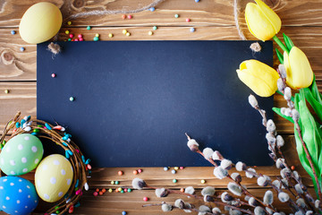 Happy Easter. Congratulatory easter background. Easter eggs and flowers.