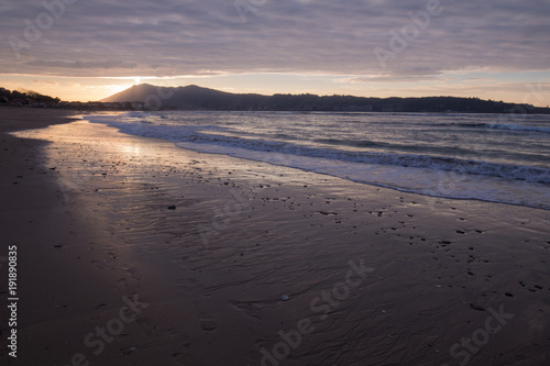 mountain Jaizkibel backlit on atlantic coastline in beautiful golden sunset, hendaye, france
