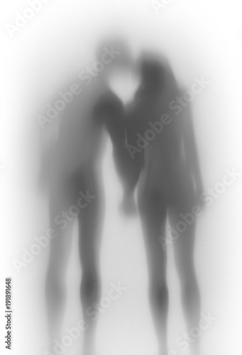 Beautiful lover couple together, body silhouette from behind. Hold each others hand, kiss.