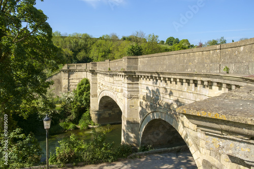 Historic Avoncliff Aqueduct carries the Kennet and Avon Canal over the River Avon and the Bath to Westbury railway line, at Avoncliff in Wiltshire, England