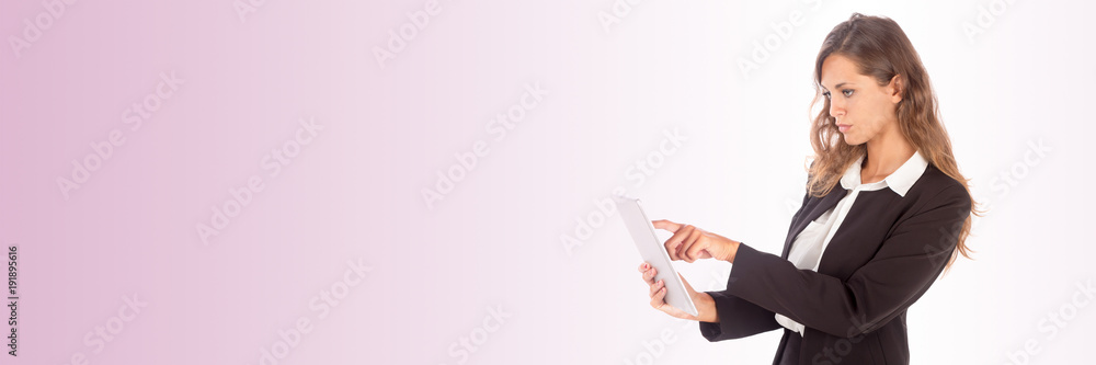 Beautiful young business woman working with a tablet; copy space photo, customizable background Beautiful young business woman working with a tablet; copy space photo, customizable background