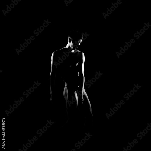 Black and white silhouette of male ballet dancer.