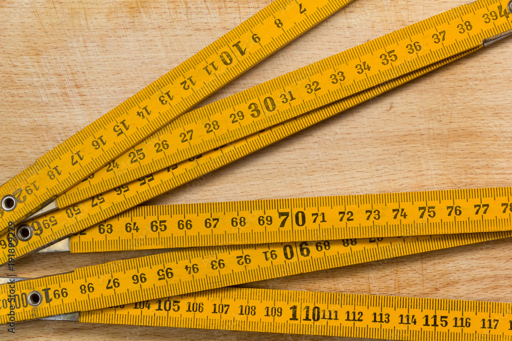 Measuring Stick on a Wooden Table Measuring Stick on a Wooden Table