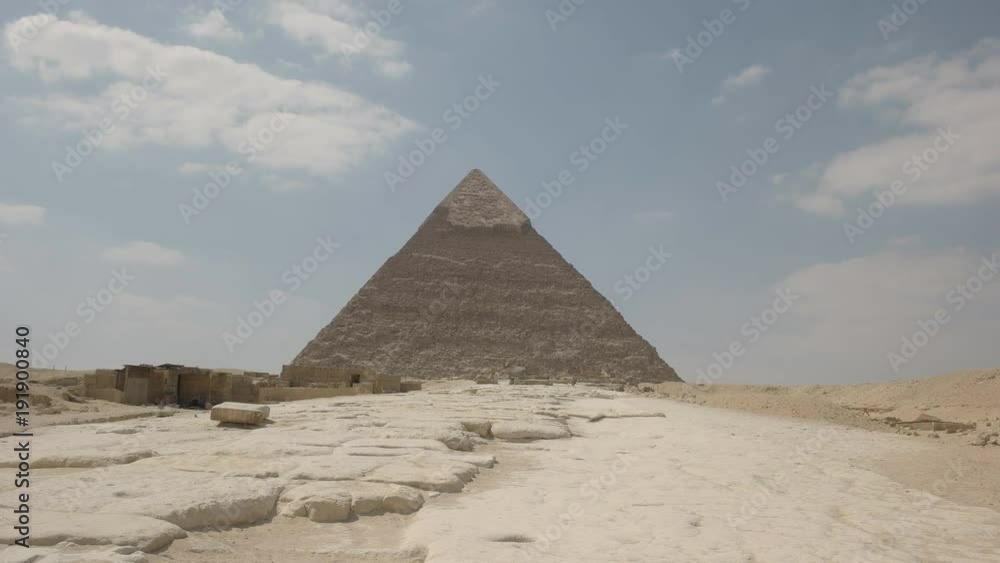 pigeons land on the ground in front of the pyramid of khafre at giza near cairo,egypt pigeons land on the ground in front of the pyramid of khafre at giza near cairo,egypt