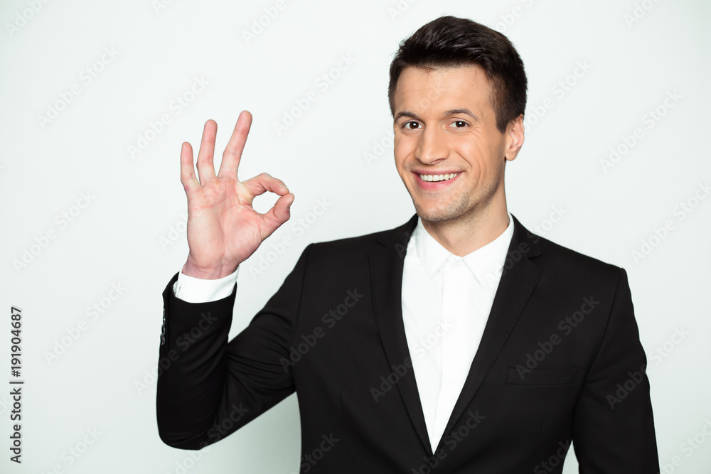 This is a good result. Stylish handsome smiling modern businessman in smart casual wear looks at the camera and picks up his thumb up. This is a good result. Stylish handsome smiling modern businessman in smart casual wear looks at the camera and picks up his thumb up.