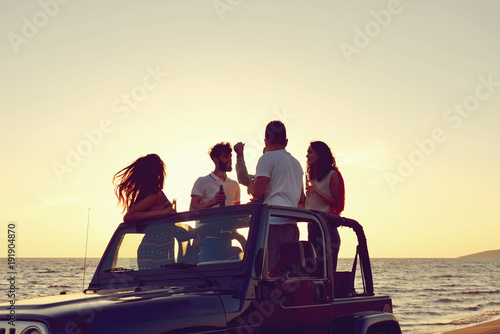 Group of happy friends making party in car - Young people having fun drinking champagne © FS-Stock
