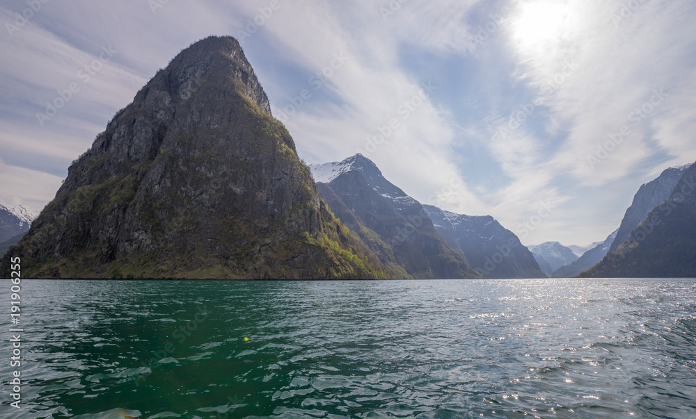 aurlandsfjord under blue cloudy sky in early summer