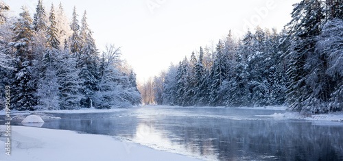 Sunrise river in a cold winter landscape with snow and frost © Conny Sjostrom