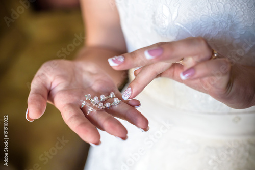 Bride shows wedding ring. Brideshows the wedding ring to friends.