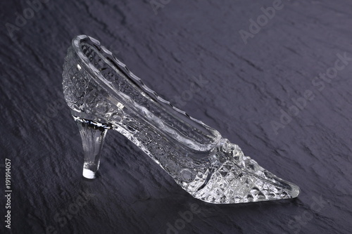 Crystal Cinderella shoes on a dark stone background