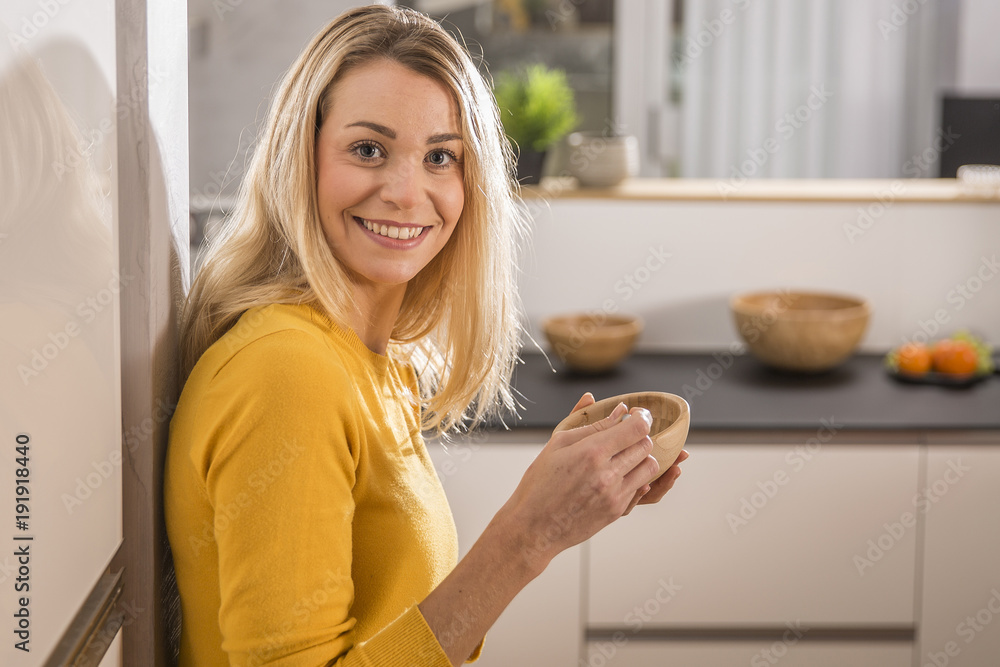 Young woman in home kitchen Young woman in home kitchen