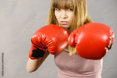 Woman wearing boxing gloves © anetlanda